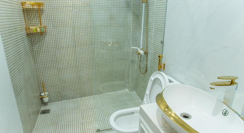 a white toilet sitting in a bathroom next to a sink, Simon House in Quy Nhơn (Bình Định)