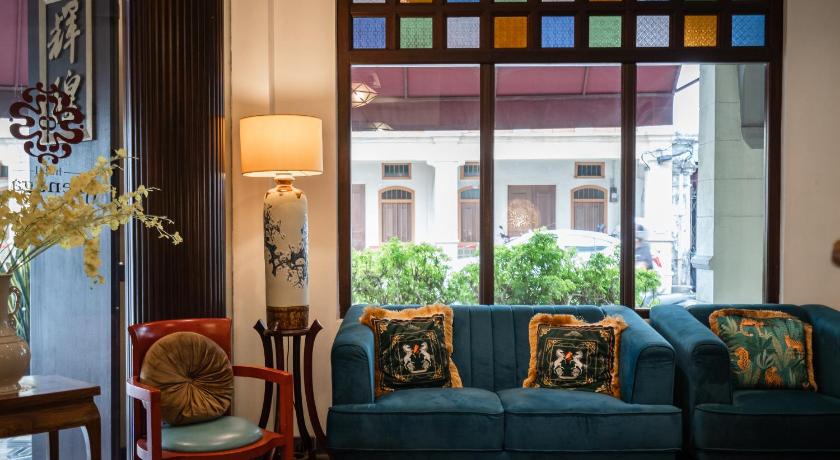 a living room filled with furniture and a window, Hotel Penaga in Penang