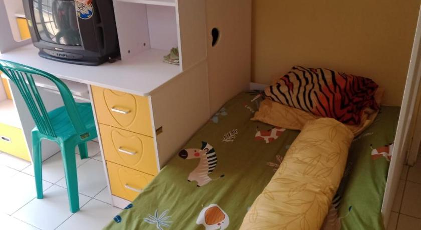 a small child sleeping on a bunk bed, Villa kota bunga cipanas 3 kamar baru renovasi full wifi in Puncak