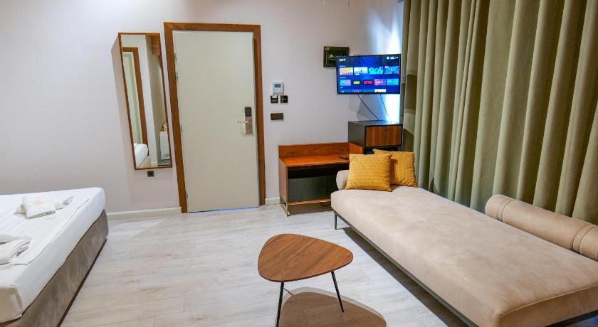 Foto, millel on kujutatud King-tuba - Mullivanniga (King Room with Spa Bath) 2
