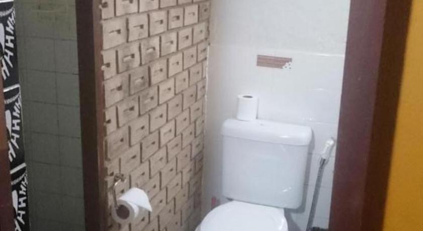 a bathroom with a toilet and a sink, Laranjeiras Hostel in Salvador