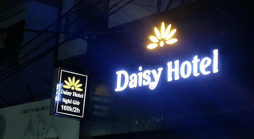 a neon sign on the side of a building, Daisy Hotel in Ho Chi Minh City