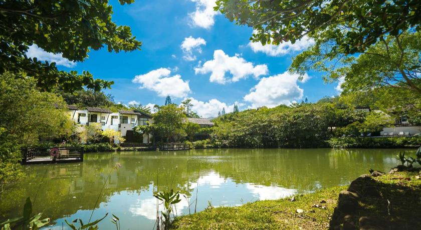 a river with houses and trees in front of it, Mudanwan Villa in Kenting