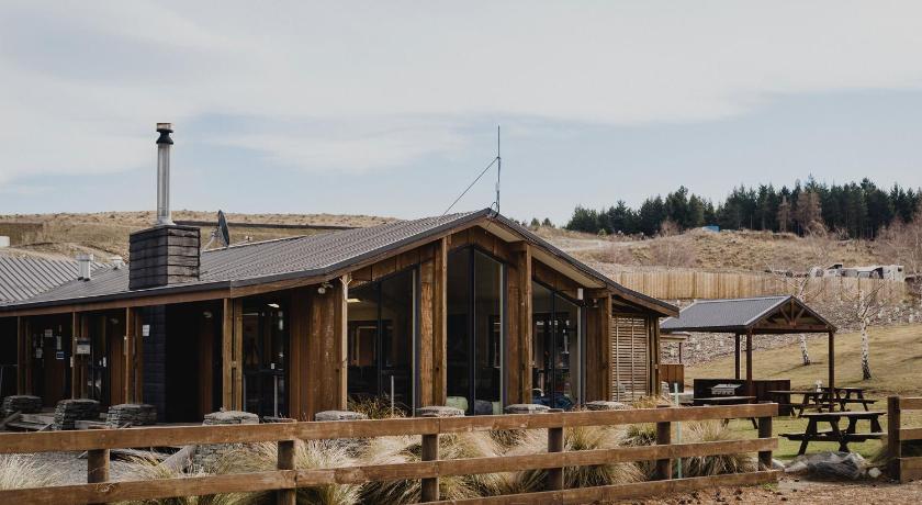 a large wooden structure with a train on top of it, Lakes Edge Lodge in Lake Tekapo