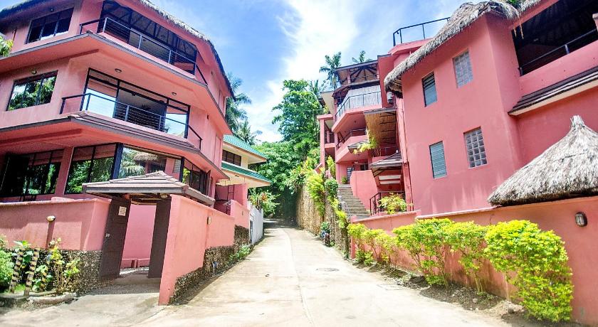 a row of houses in front of a building, Punta Rosa Hotel in Boracay Island