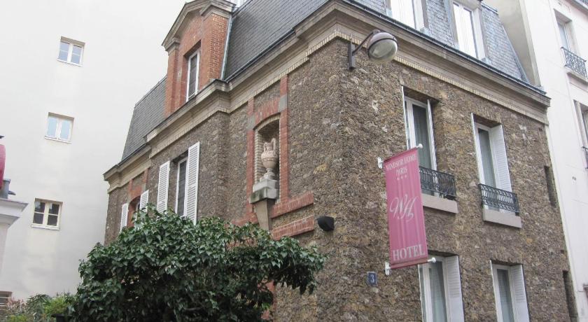 a brick building with a sign on the side of it, Windsor Home Paris in Paris
