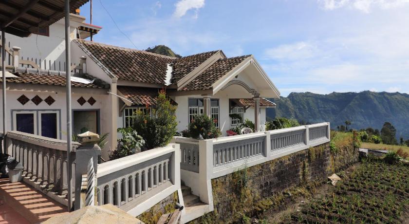 a house with a view of the ocean and mountains, Good Karma Guesthouse in Bromo