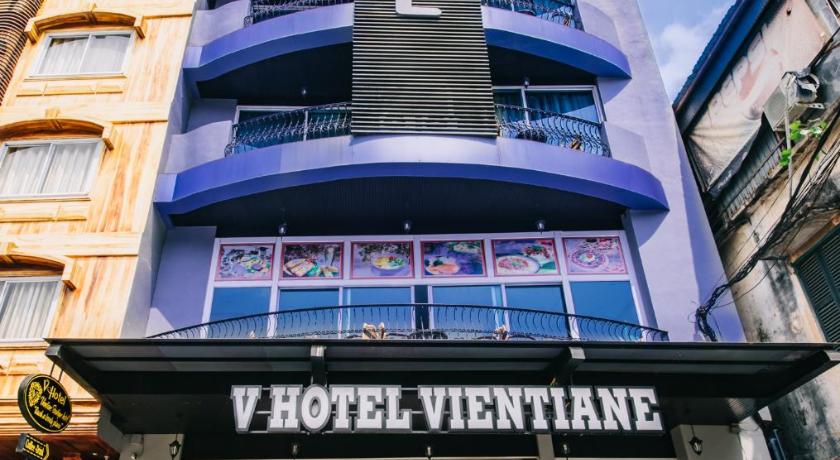 a large building with a sign on the side of it, V Hotel Vientiane in Vientiane