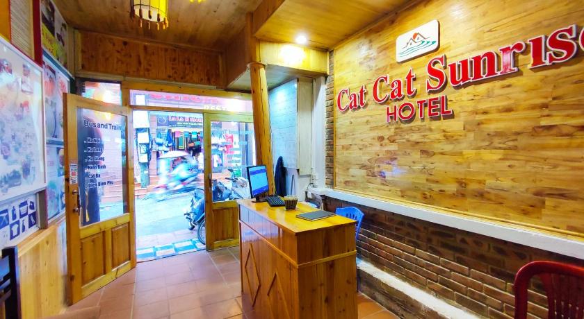 a restaurant with a bar and a clock on the wall, Cat Cat Sunrise Hotel in Sapa
