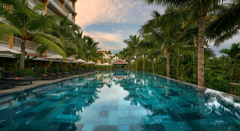 a swimming pool filled with lots of blue water, La Siesta Hoi An Resort & Spa in Hoi An