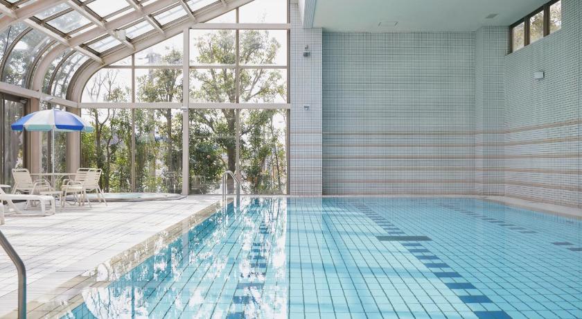a swimming pool with a pool table and chairs, HOTEL MYSTAYS PREMIER Narita in Narita