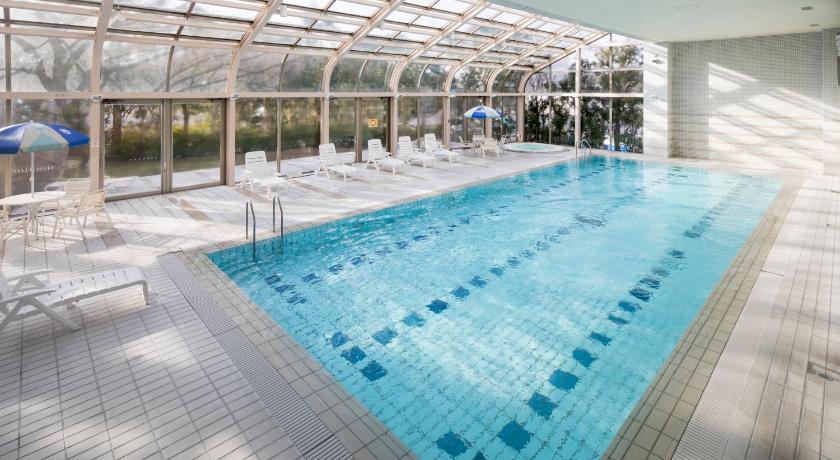 a swimming pool filled with lots of blue water, HOTEL MYSTAYS PREMIER Narita in Narita