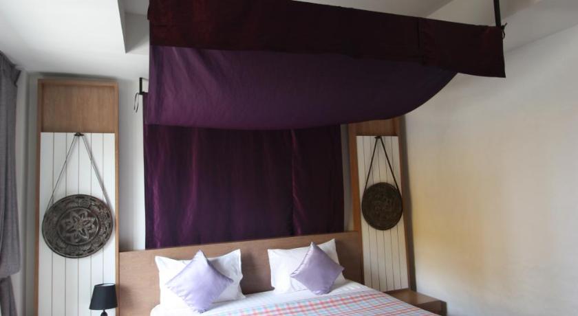 a bedroom with a bed and a canopy, Nakorn De Sukhothai Hip Hotel in Sukhothai