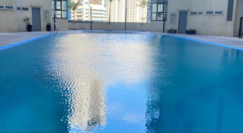 Comfy and Cozy 2BR Condo in BGC with WiFi and Netflix photo