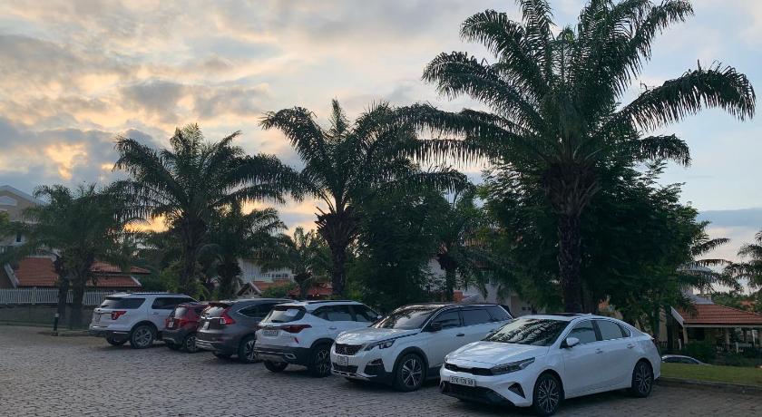 a parking lot filled with lots of parked cars, Biet thu Mui Ne - Villas Muine Domaine in Phan Thiet