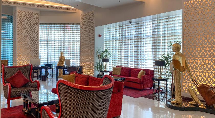 a living room filled with furniture and a large window, Swiss-Belhotel Seef Bahrain in Manama
