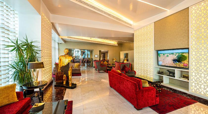 a living room filled with furniture and a tv, Swiss-Belhotel Seef Bahrain in Manama
