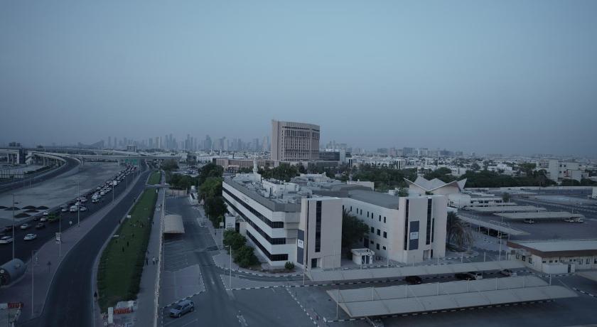 a large building on a city street, Sun & Sands Seaview Hotel in Dubai