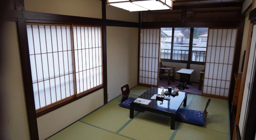 a living room filled with furniture and a window, Oyado Eitaro in Takayama