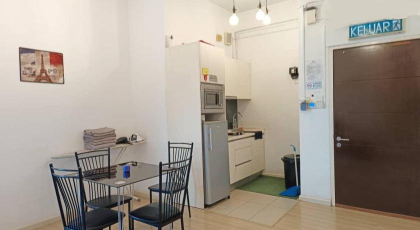 a kitchen with a table and chairs and a refrigerator, 3 Room SUNWAY NEXIS KOTA DAMANSARA 5min MRT 7min Tropicana mall in Kuala Lumpur