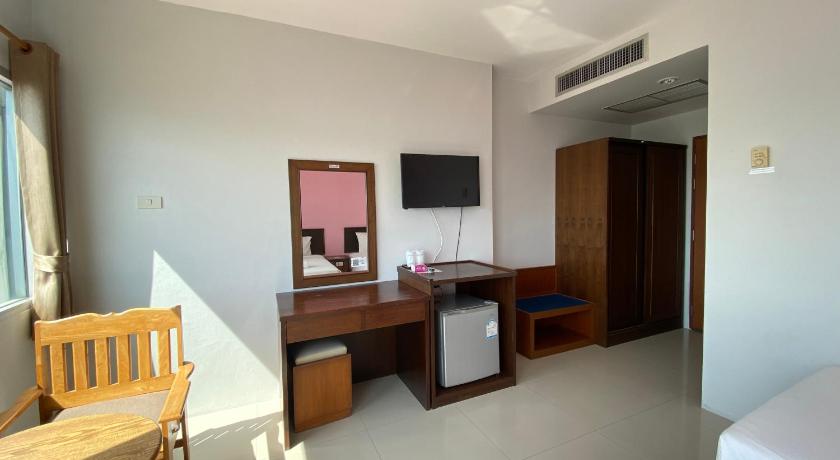 a room with a bed, desk, chair and a tv, Prachuap Beach Hotel (SHA Plus+) in Prachuap Khiri Khan