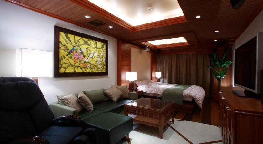 a living room filled with furniture and a tv, Hotel Water Gate Tokuyama adult only in Shunan