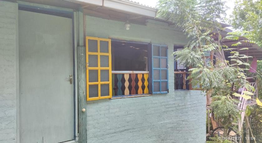 a window that is open in front of a house, Tahan Guest House in Kuala Tahan