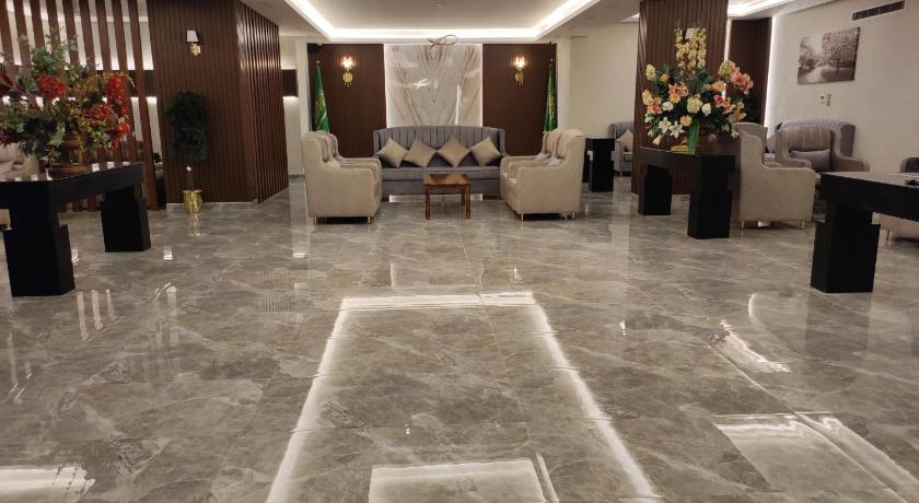 a living room filled with lots of furniture, Brzeen Hotel - Riyadh - فندق برزين الرياض in Riyadh
