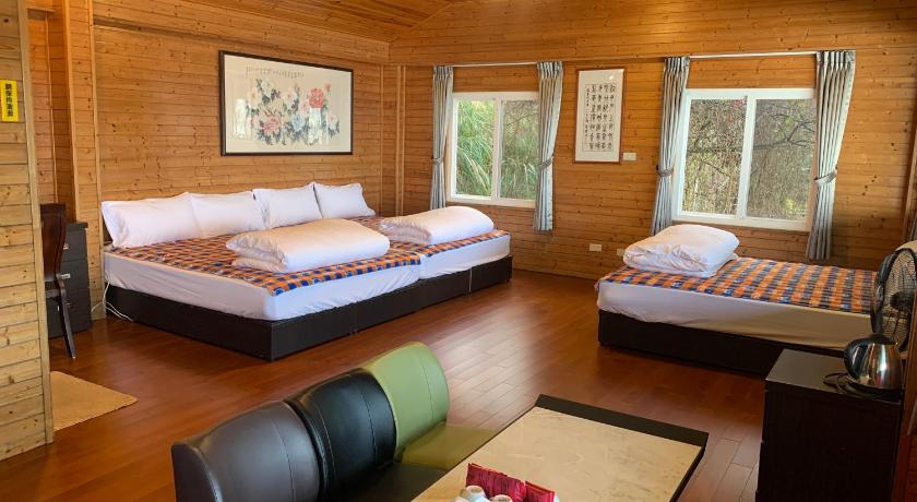 a living room filled with furniture and a bed, Tianen Farm in Taoyuan