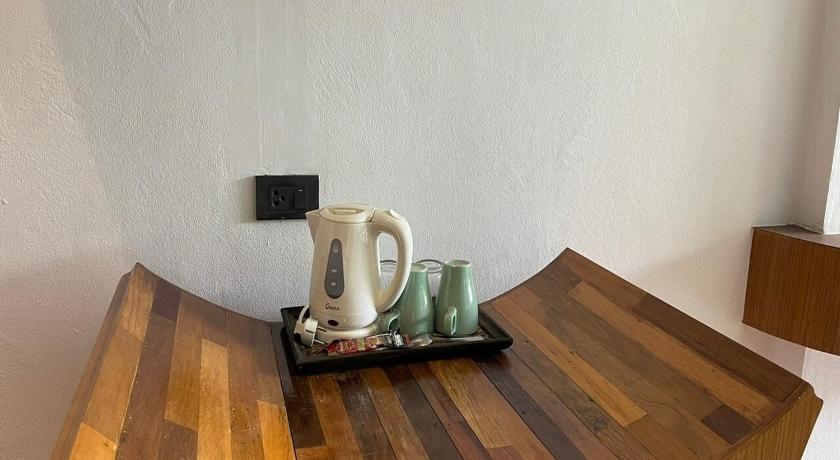a wooden table topped with a coffee mug, AC 2 Resort in Ko Tao