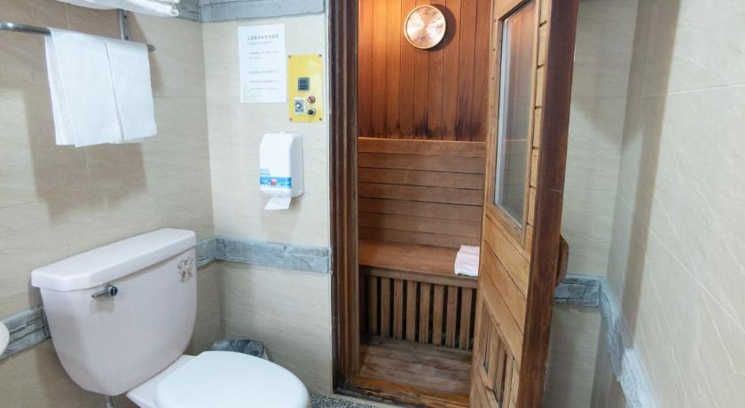 a bathroom with a toilet and a sink, Beethoven Express Hotel in Taoyuan