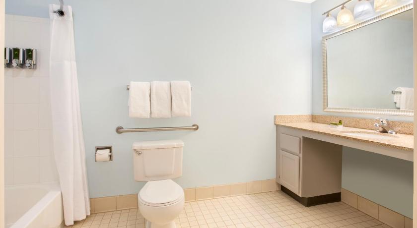 a white toilet sitting next to a sink in a bathroom, Sonesta ES Suites Burlington VT in Williston (VT)