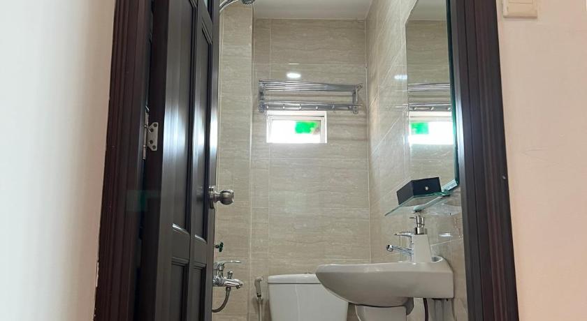 a bathroom with a toilet, sink, and shower, Lan Anh Hotel in Ho Chi Minh City