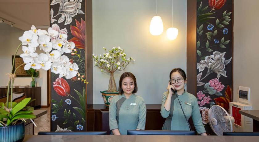 two women standing in front of a mirror in a bathroom, Cozy Danang Boutique Hotel in Da Nang