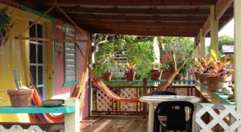 a patio area with a fence and a patio area, Naniqui Cottage - Adults Only - Parking Golf Car Only in Culebra