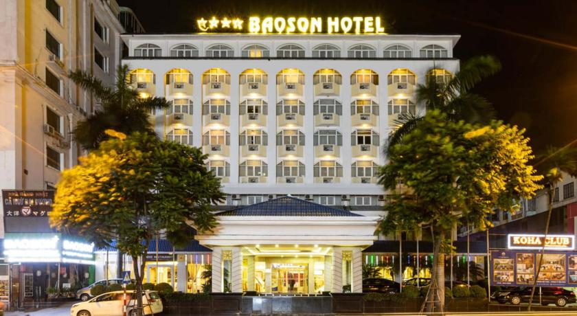 a large building with a clock on the front of it, Baoson International Hotel in Hanoi