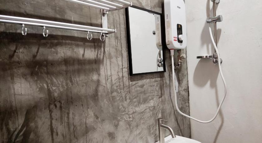 a bathroom with a sink, toilet, and mirror, B' Hotel Kajang in Kuala Lumpur