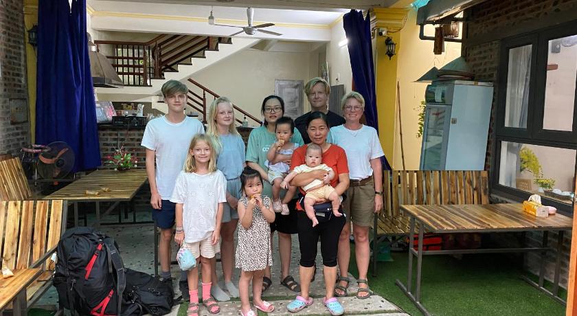 a family posing for a picture in a tent, Center Tam Coc homestay in Ninh Bình