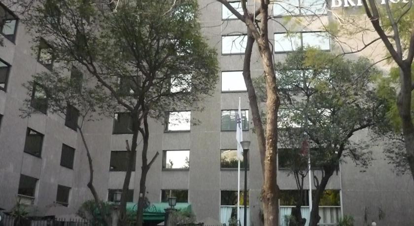 a tall building with a tree in front of it, Hotel Bristol in Mexico City