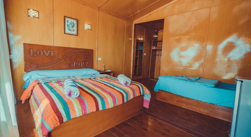 a bedroom with a bed and a desk, Crazy Horse Camp in Nuweiba