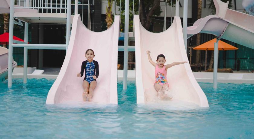 two girls are playing in a swimming pool, The GEMS MINING Pool Villas Pattaya (SHA Plus+) in Pattaya