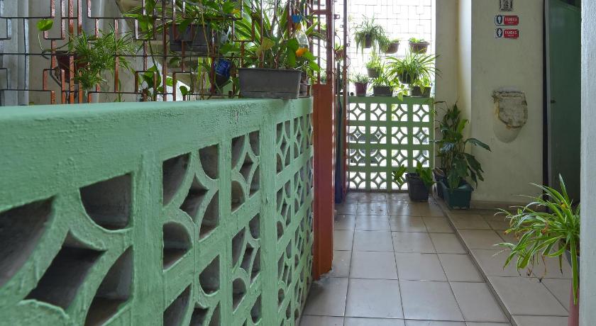 a garden area with a fence and a green wall, SPOT ON 90625 Super Green Grass Hotel in Batu Pahat