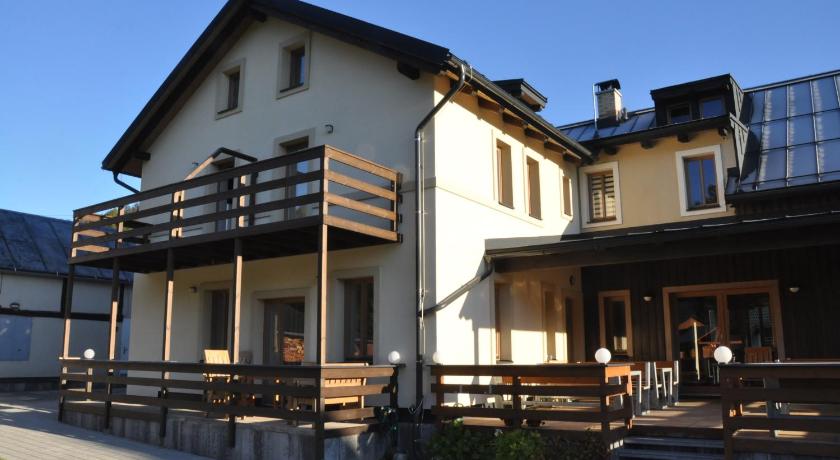 a large building with a wooden roof and wooden floors, Chata Vermont in Bedrichov U Jablonce Nad Nisou