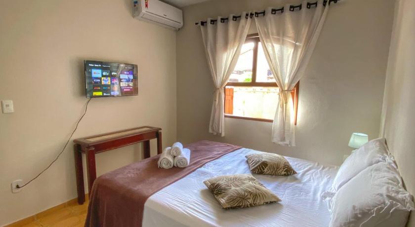 Casa aconchegante a 400m da Praia da Tartaruga - Ar condicionado - WIFI 450MB - Netflix - Cozinha Co