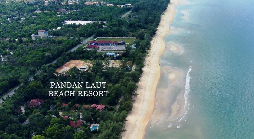 a beach with palm trees and palm trees, Pandan Laut Beach Resort in Merang
