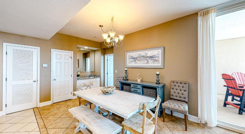 a living room filled with furniture and a table, Lighthouse Condominiums IV in Gulf Shores (AL)