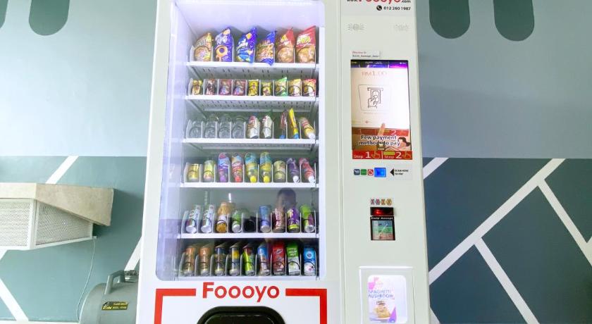 a refrigerator that has some food inside of it, D'concept Hotel Kulim in Kulim
