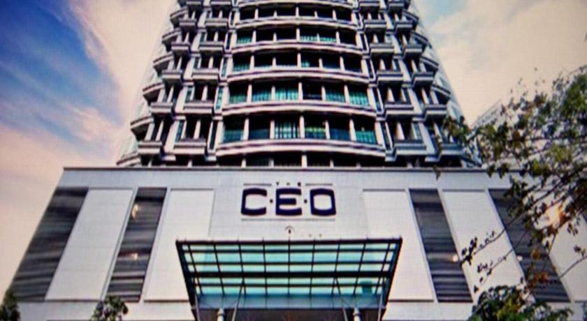 a tall building with a clock on the front of it, The CEO Executive Suites in Penang
