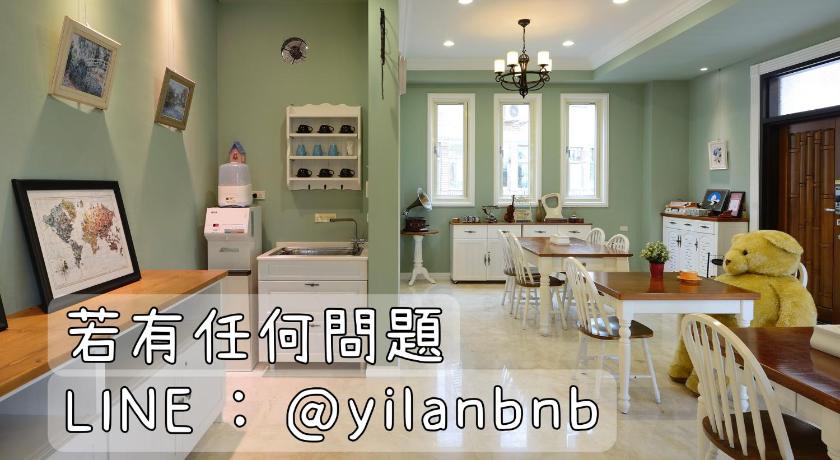 a living room filled with furniture and decor, Dancing Butterfly Family Inn in Yilan