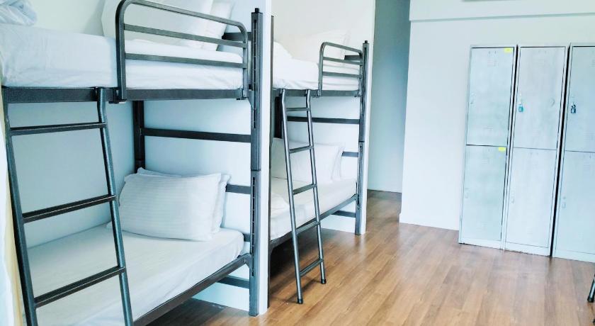 a room with two bunk beds and a toilet, Valencia Dorm summer suites KLCC in Kuala Lumpur